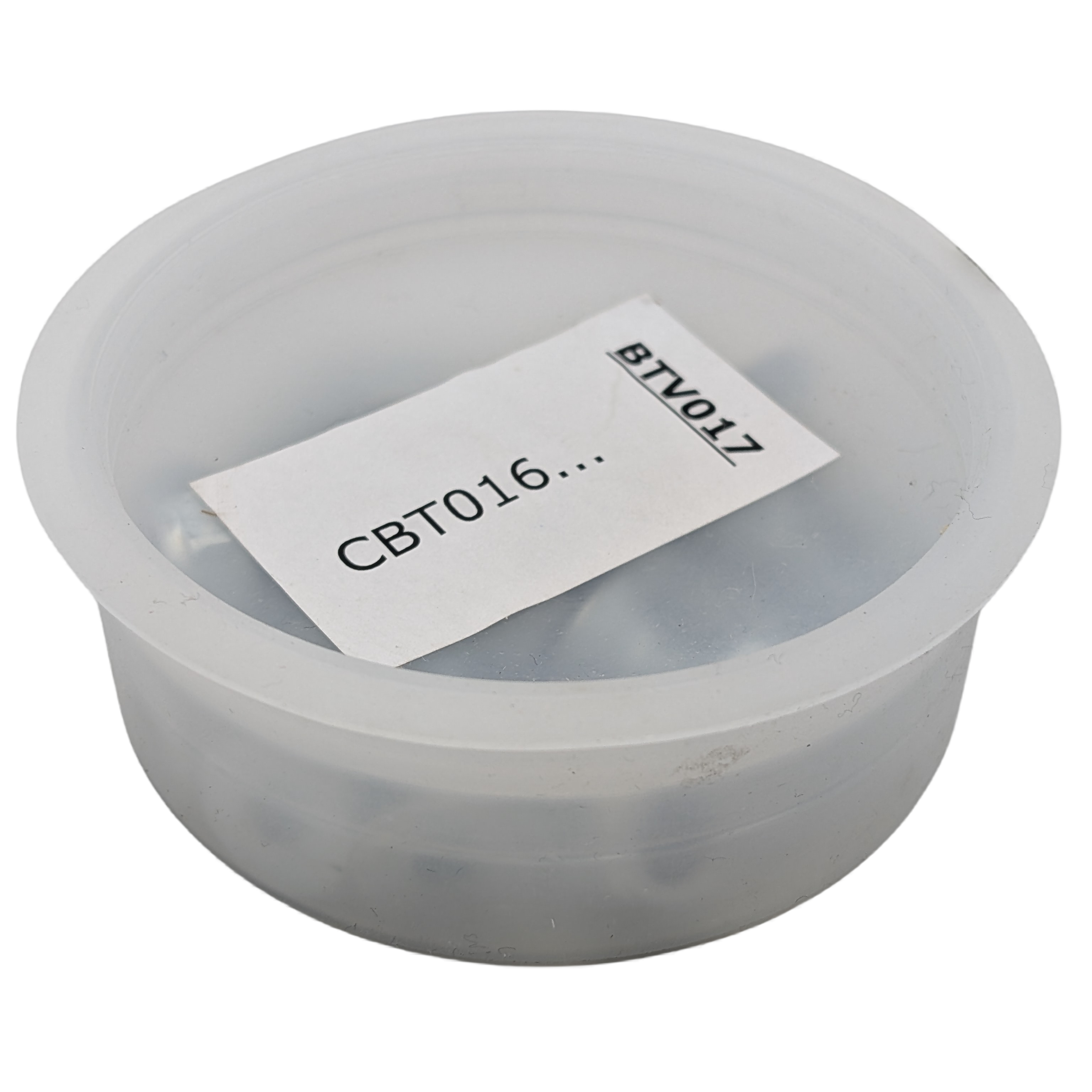 Clear plastic container with a label inside on a white background